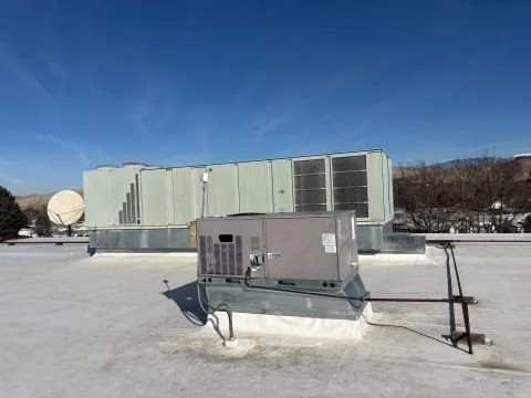 Commercial rooftop packaged HVAC units inspected during a property condition assessment