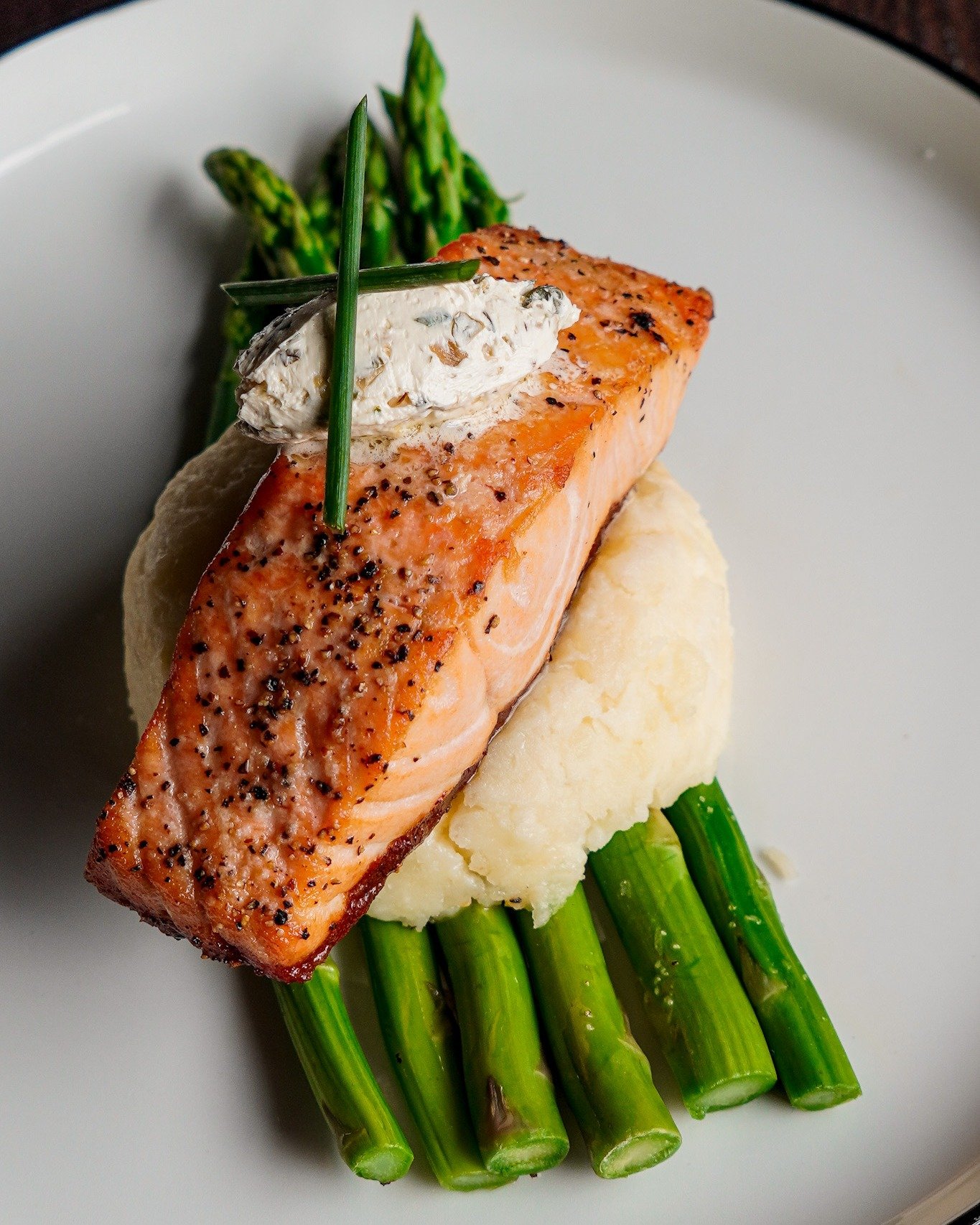 Lent specials are in full swing. 🌿🐟

Our Faroe Island Salmon leads the lineup &mdash; perfectly cooked, served with whipped potatoes and asparagus, and made for your Friday plans.

We&rsquo;ve also got:
🍺 Beer Battered Fish n&rsquo; Chips (Iceland