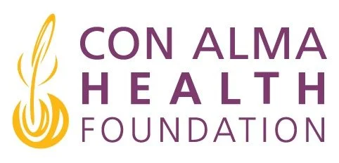 Logo for the Con Alma Health Foundation featuring a gold and purple design.