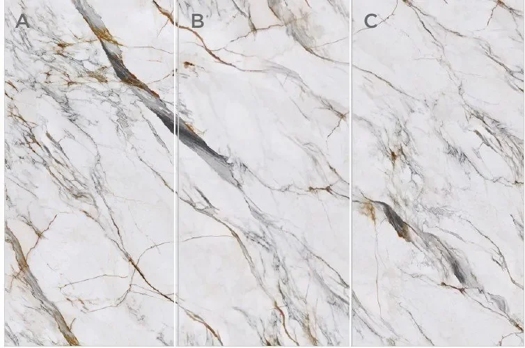 Sculpted Calacatta sintered stone slabs — white base with bold grey veining, matte finish