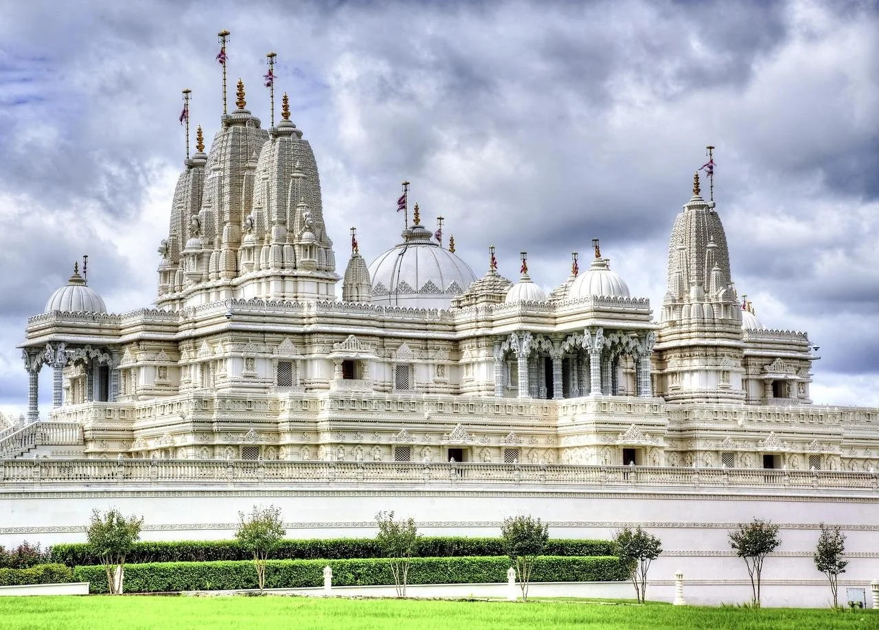 Intricately crafted in white stone, this temple reflects the purity, structure, and timeless wisdom found along the spiritual path.