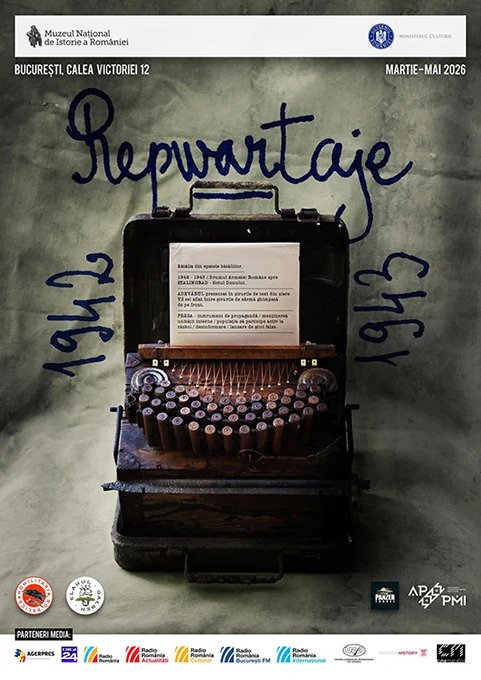 A vintage typewriter inside an open black case, with a paper inserted. The background is a wall with handwritten text in blue ink, and official logos and text in Romanian at the top. The paper has some typed text in Romanian.