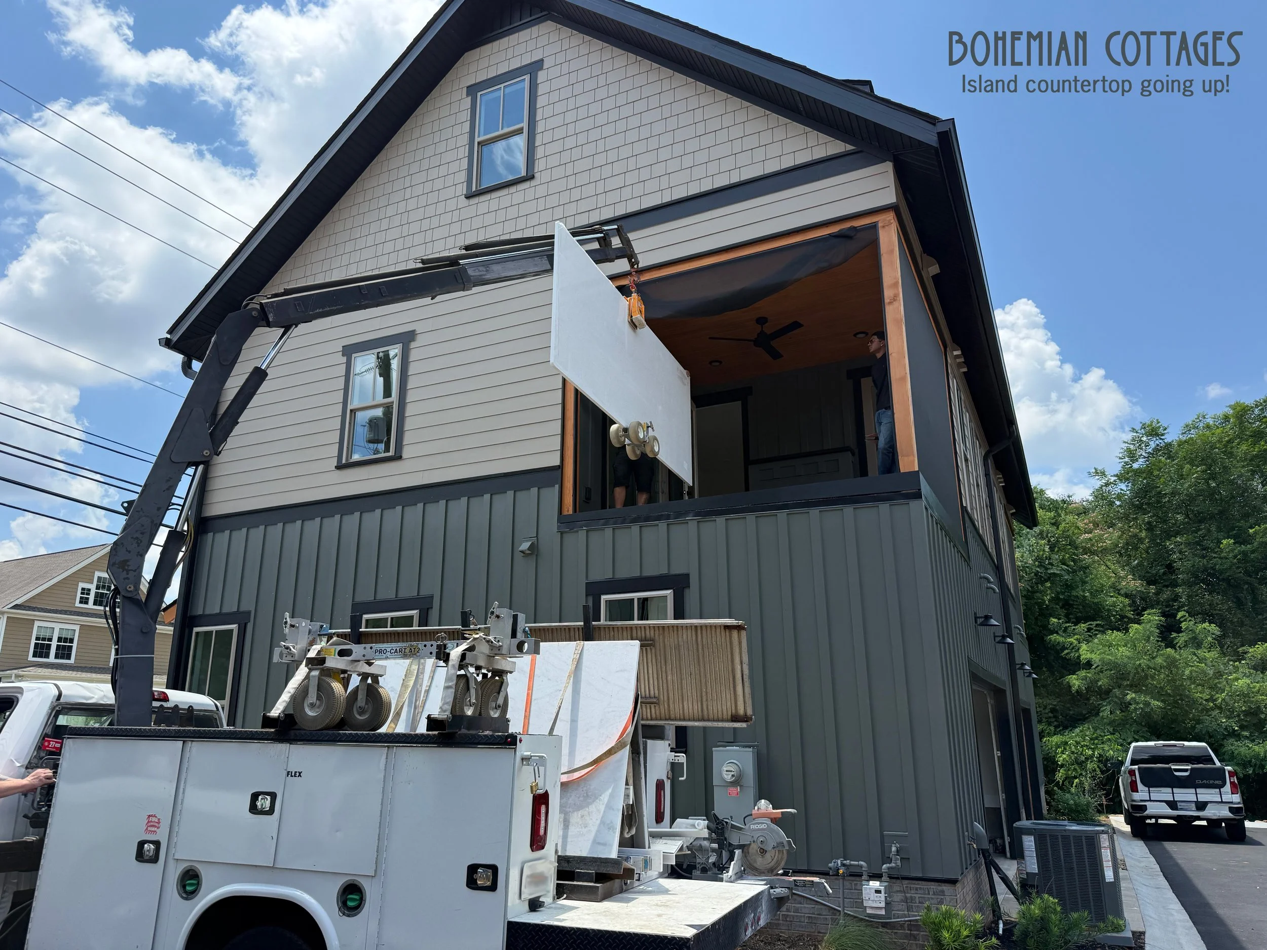 This island countertop was way too large to safely carry up the steps, so we had to call in for some mechanical backup... the good ol' boom arm