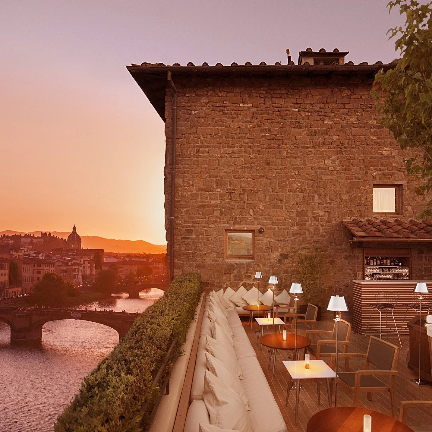 La Terrazza Rooftop Bar in Florence, Italy atop a medieval tower along the arno river.