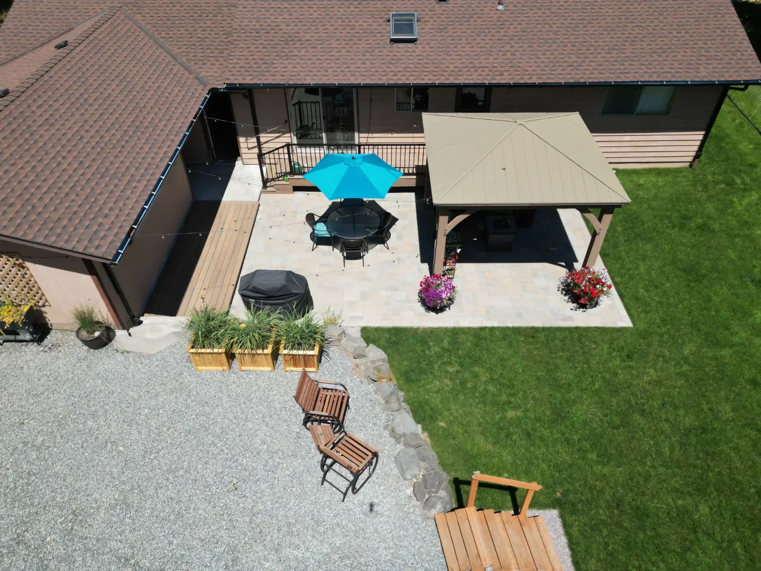 Aerial view of a backyard patio and covered outdoor living space at a residential property in Kirkland, WA