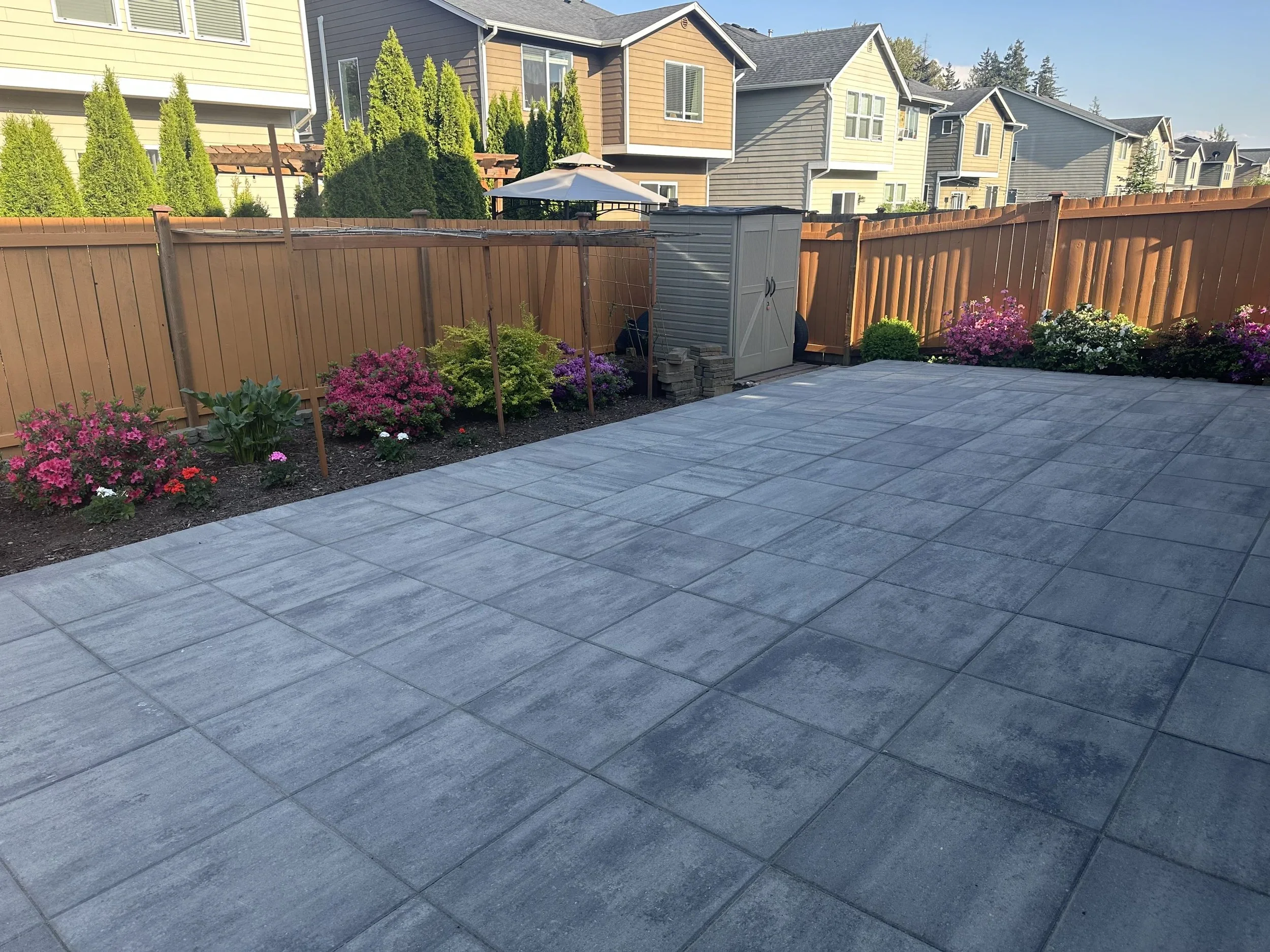 Backyard paver walkway and landscaping installation near fence company work in Bellevue, WA