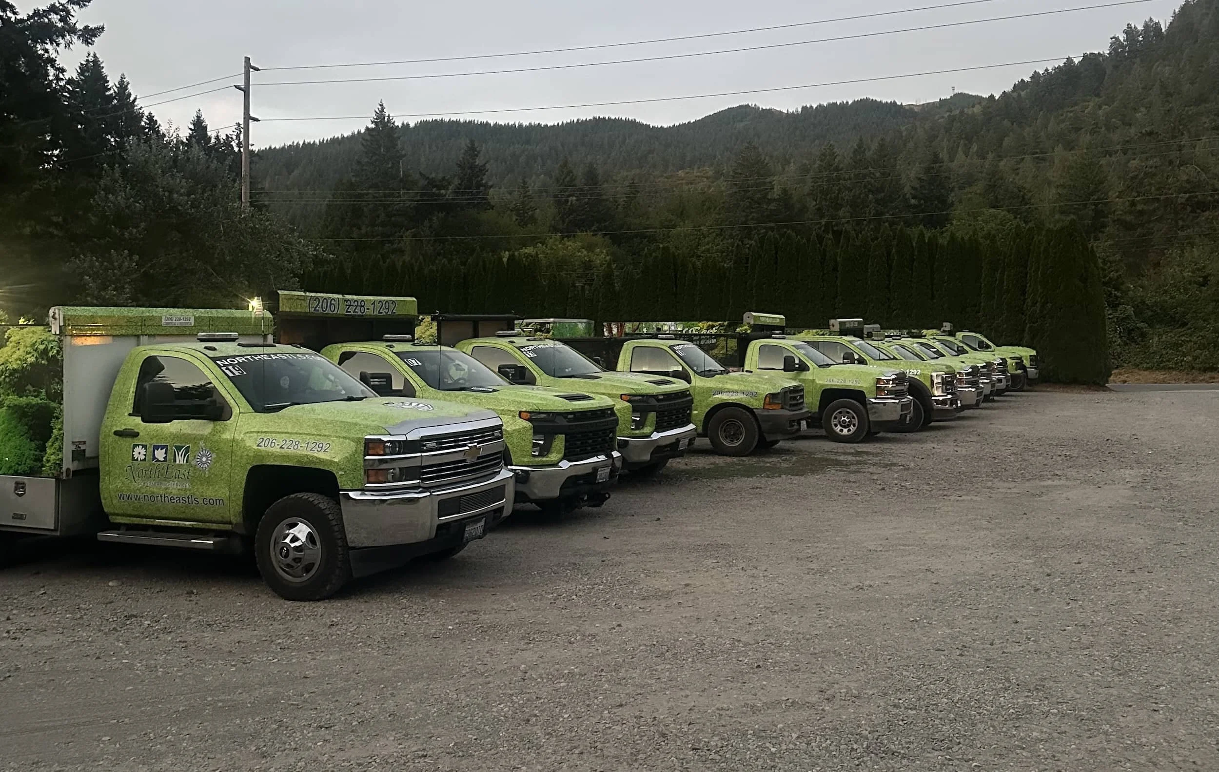 Landscaping company service trucks in Bothell WA ready for residential lawn care, turf installation, and outdoor construction services