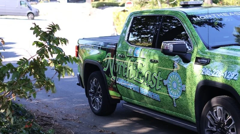 North East Landscaping Services truck on site for commercial landscape maintenance in Renton, WA