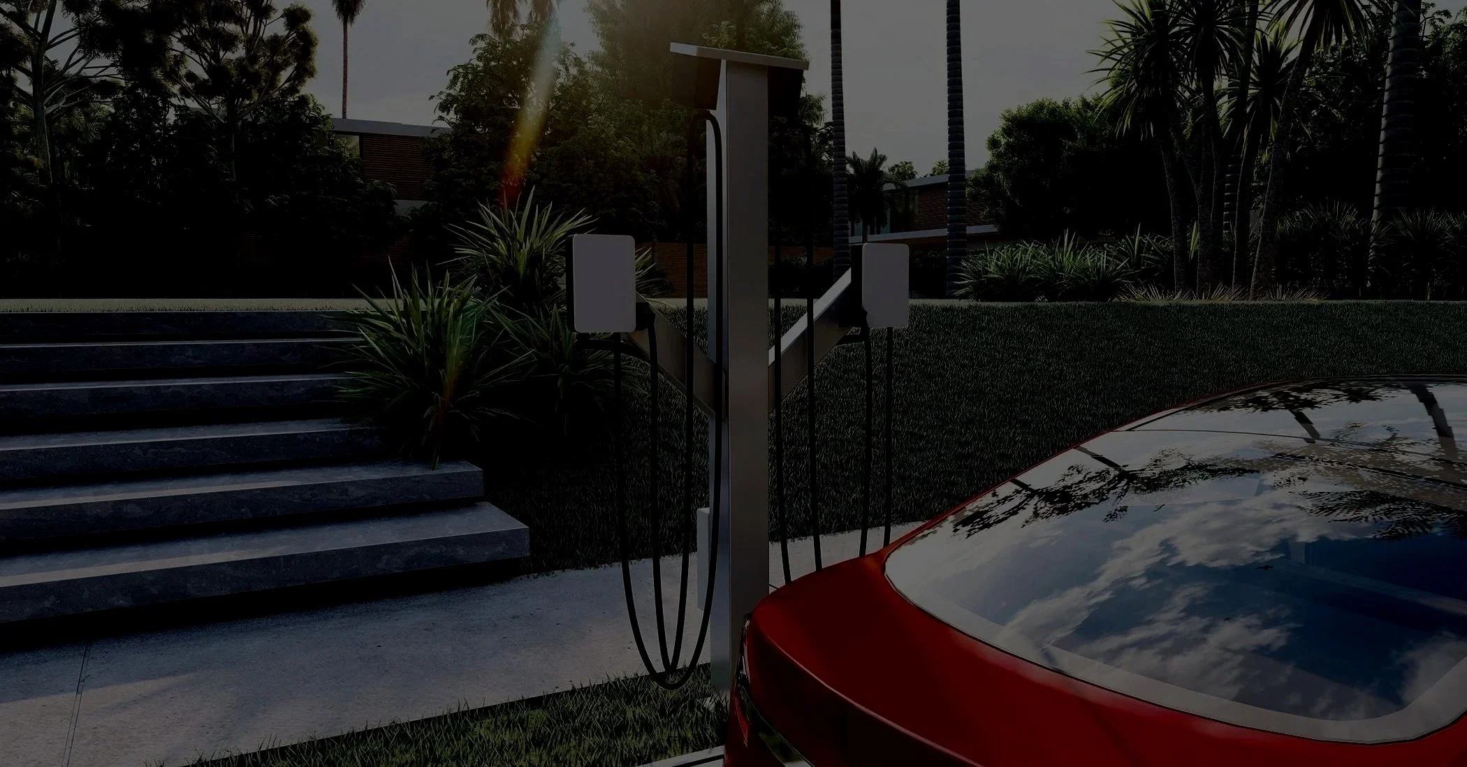 An electric vehicle charging station with a red car plugged into it, situated outdoors near steps and landscaped with plants and trees.