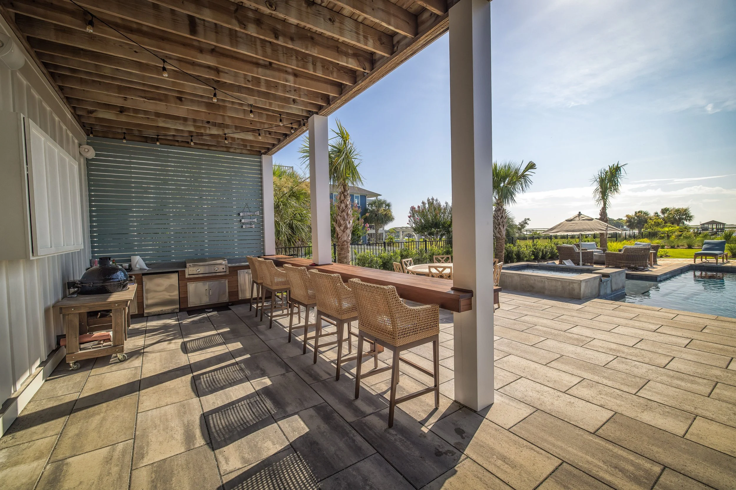 Timber pavilion with a wide patio extension in Hampstead, NC