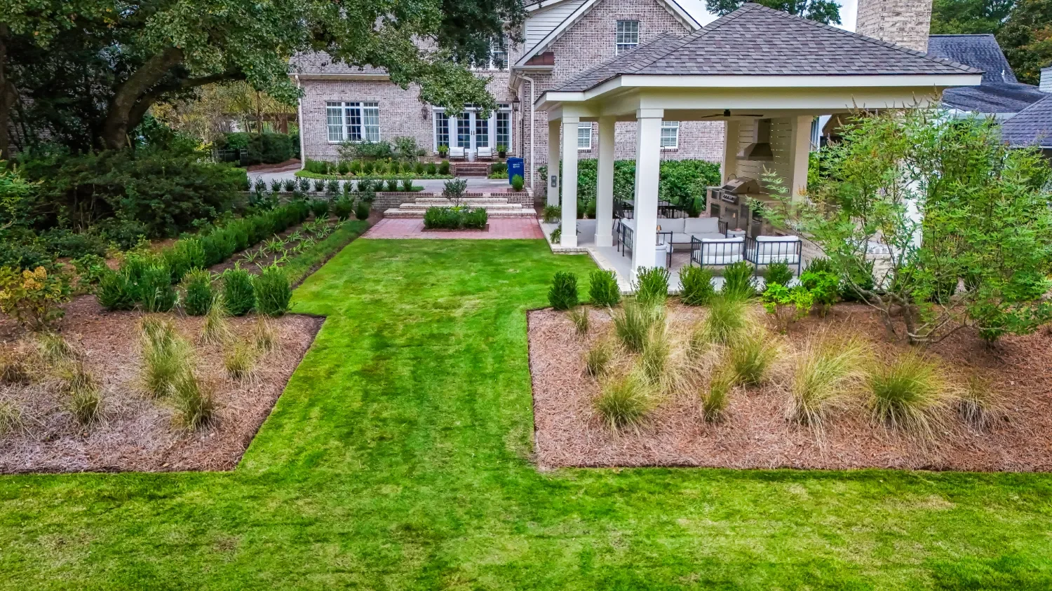Clean lawn edge and structured coastal landscape design in Myrtle Grove, NC