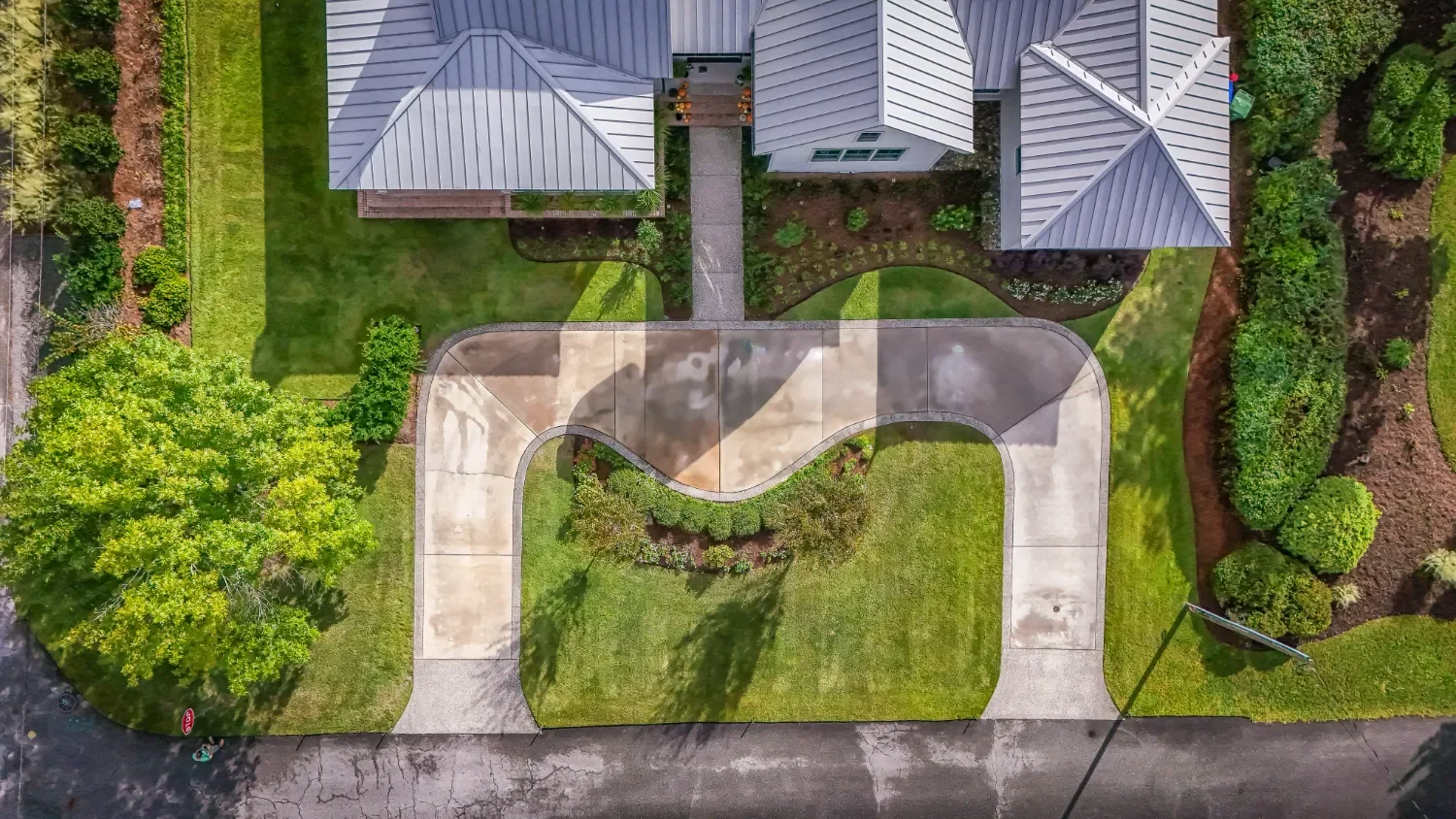 Landscape design featuring layered shrubs and grasses in Wilmington, NC