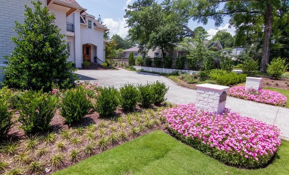 Well-maintained mulch garden borders reflecting high-end estate maintenance in Wilmington