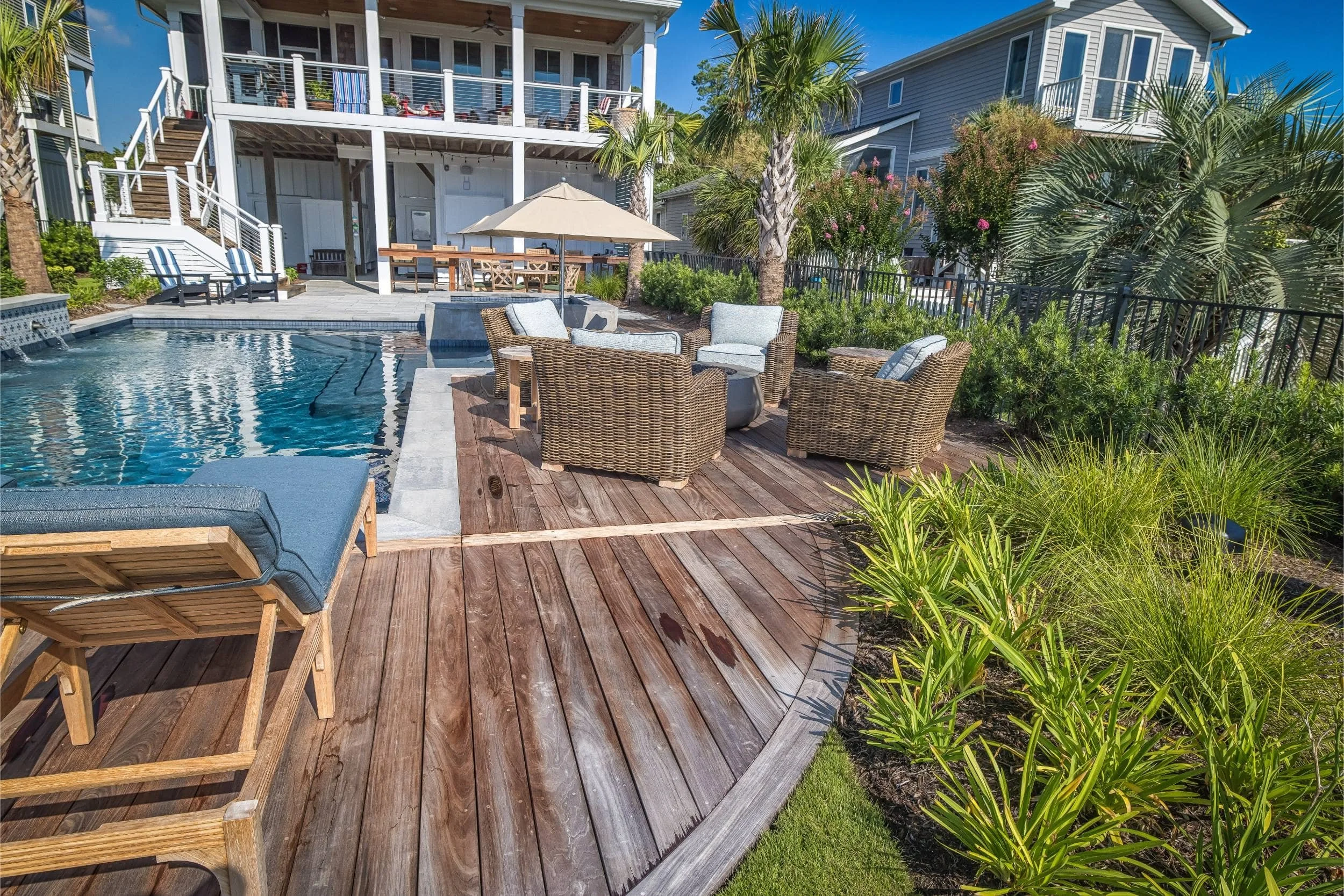 A custom pool builder near me project with spa and lounge area in Ogden, NC