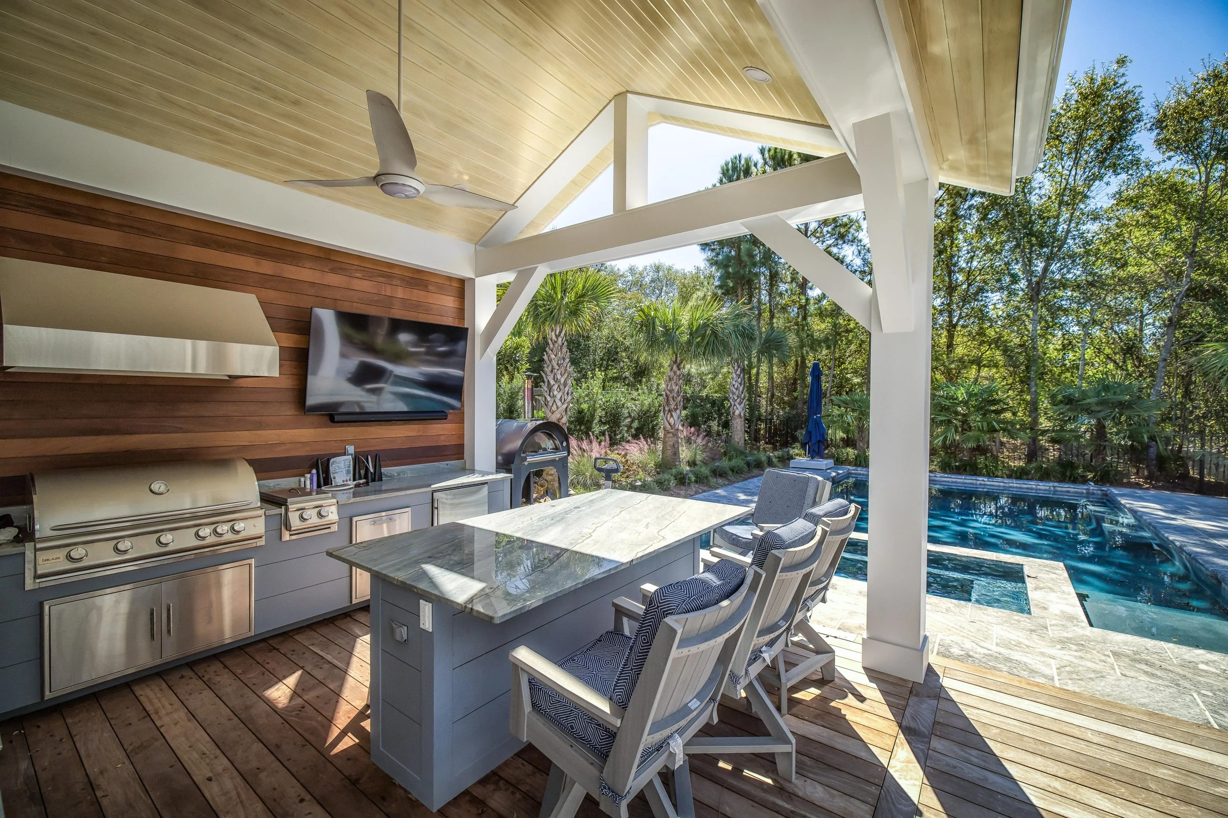 Pavilion in Landfall, NC providing shaded seating beside a landscaped outdoor living area