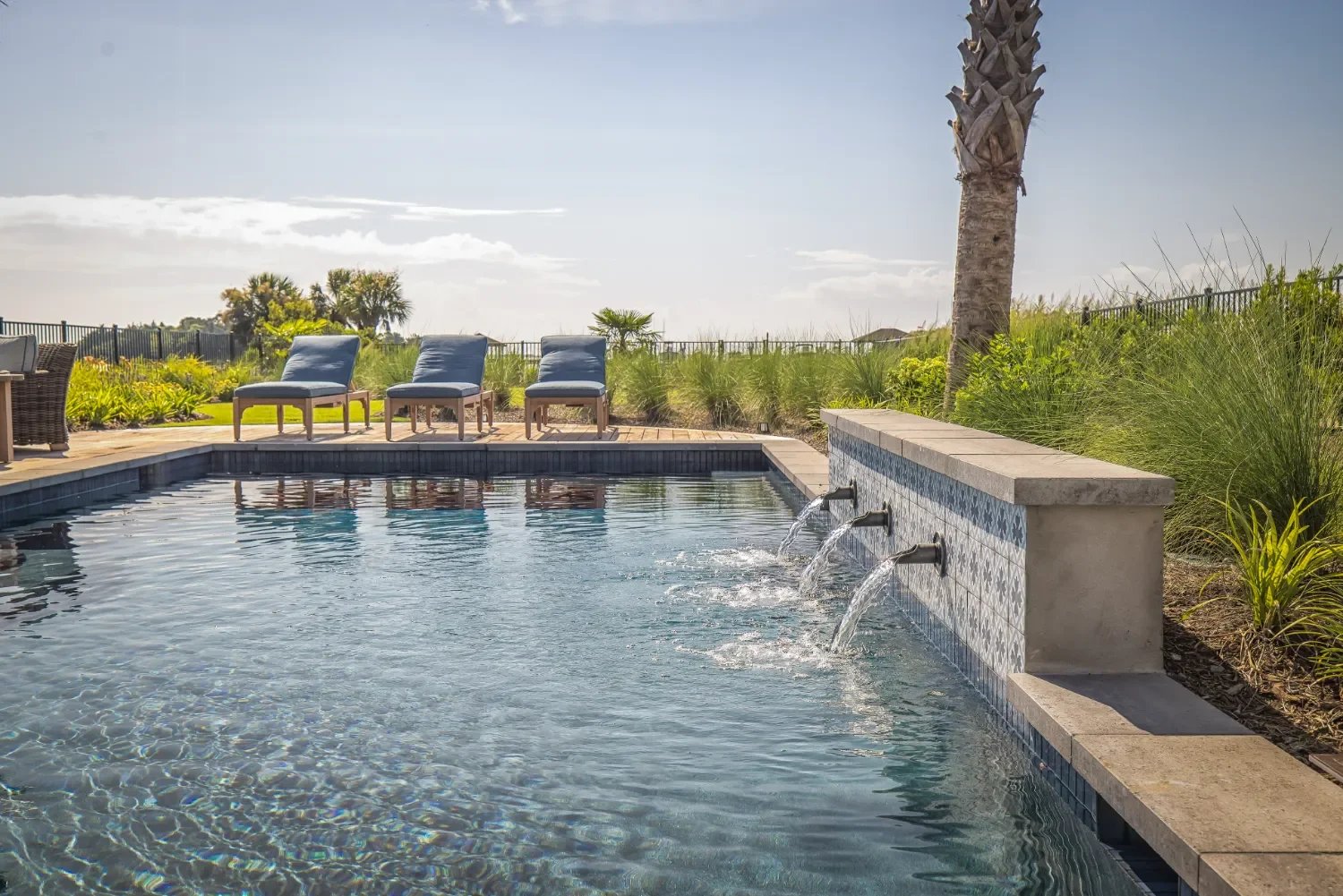 Custom stonework supporting a backyard water feature in Kure Beach, NC