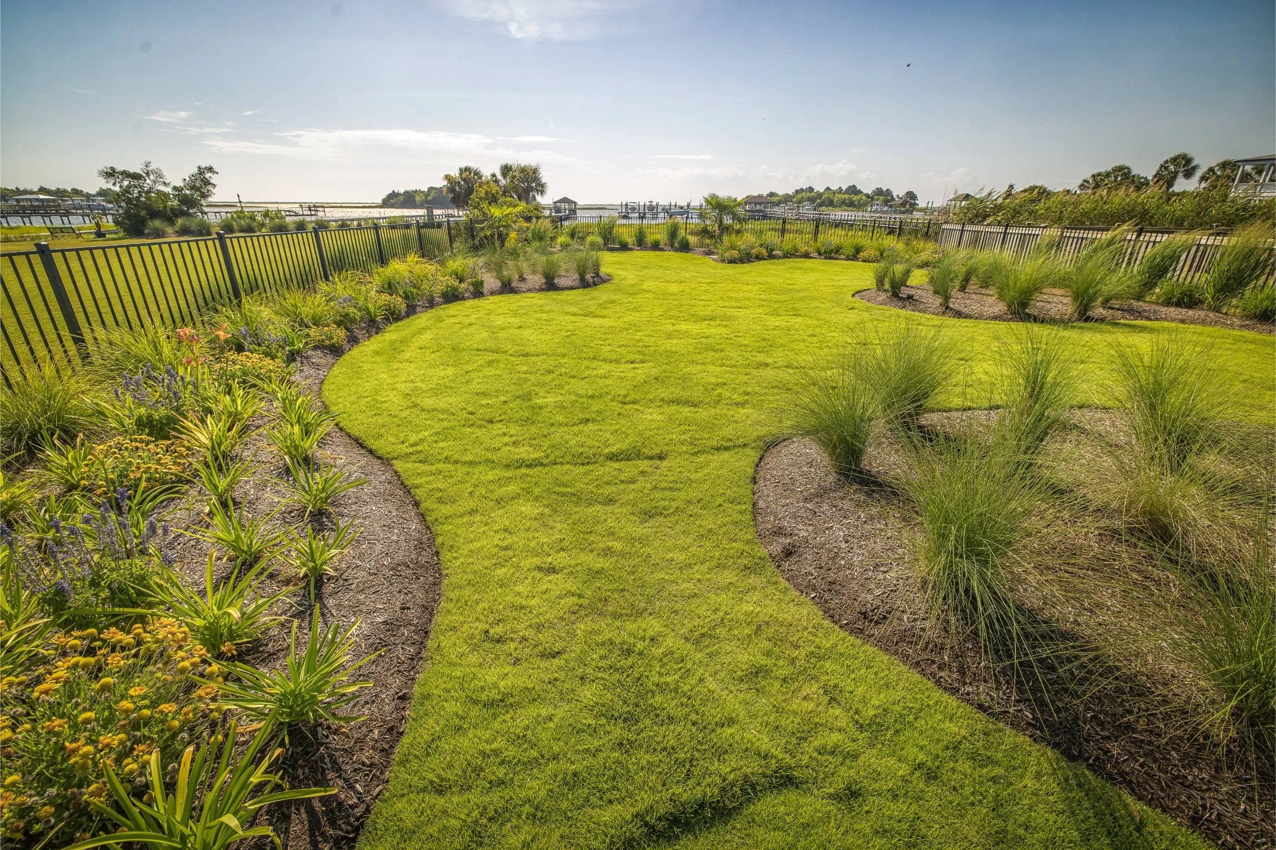 A landscaping near me project featuring lush greenery and outdoor living space in Wrightsville Beach, NC