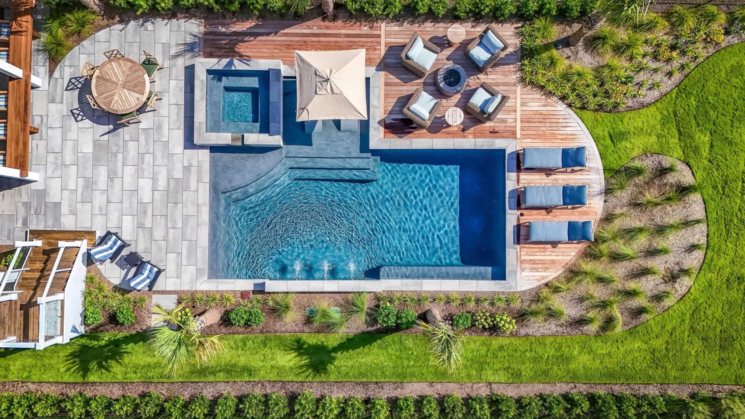 Large outdoor fireplace under a partially covered pavilion in Landfall, NC