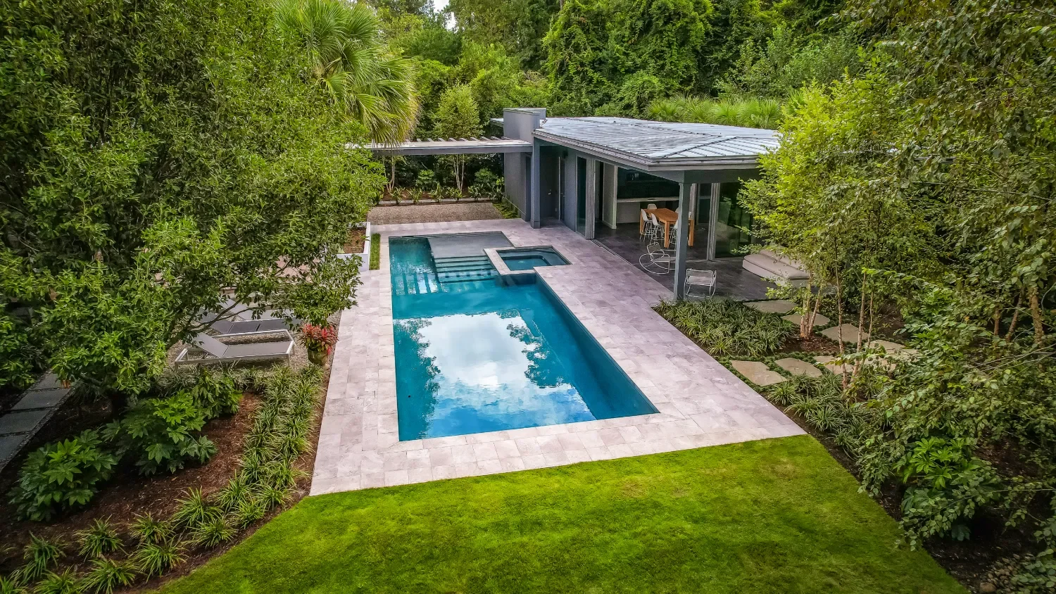 Outdoor living terrace overlooking native plantings in Figure Eight Island, NC