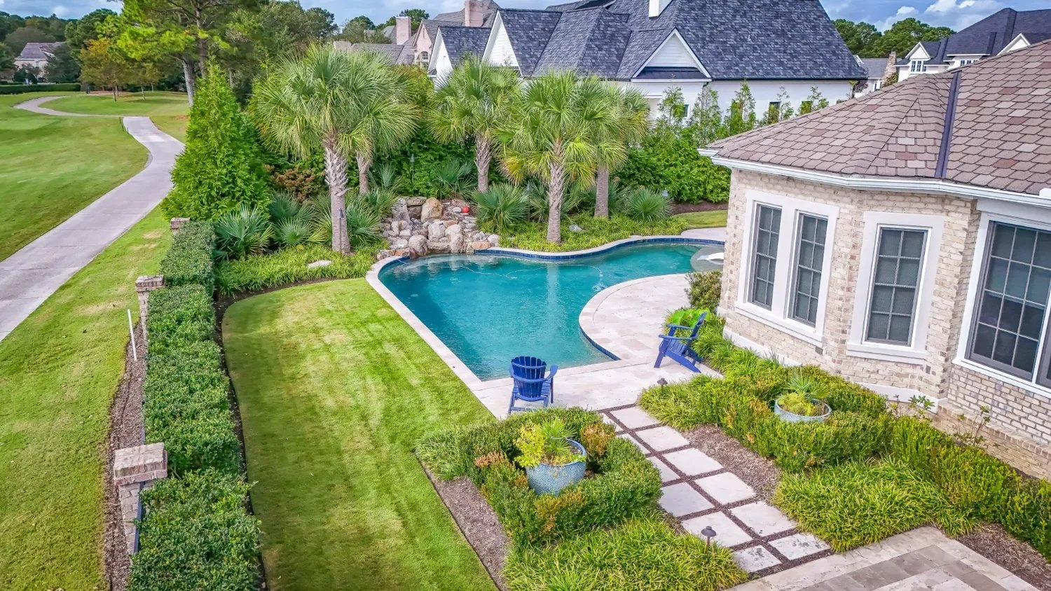 Coastal landscape design with upgraded patio elements in Figure Eight Island, NC