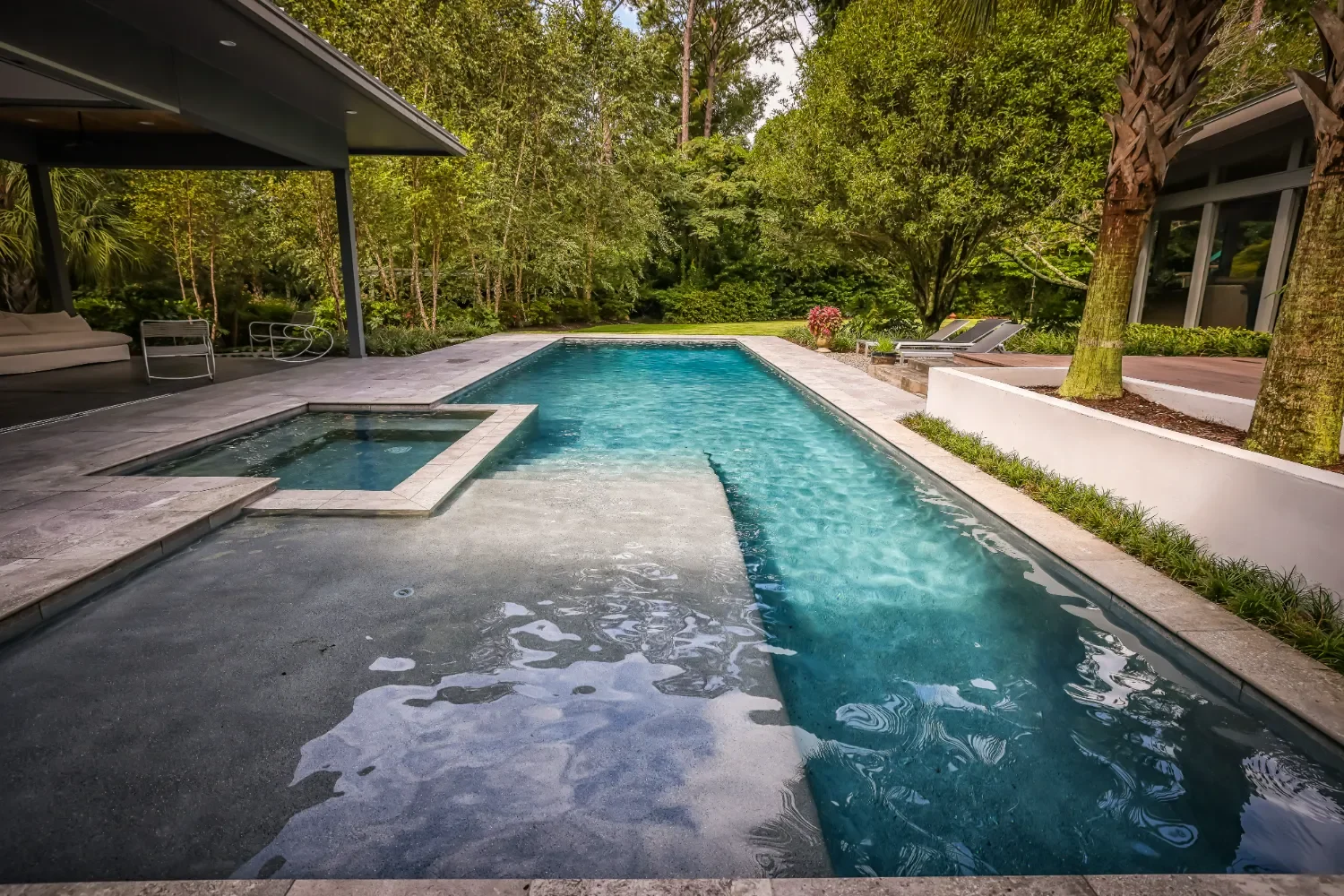 Modern hardscape patio beside coastal vegetation in Ogden, NC