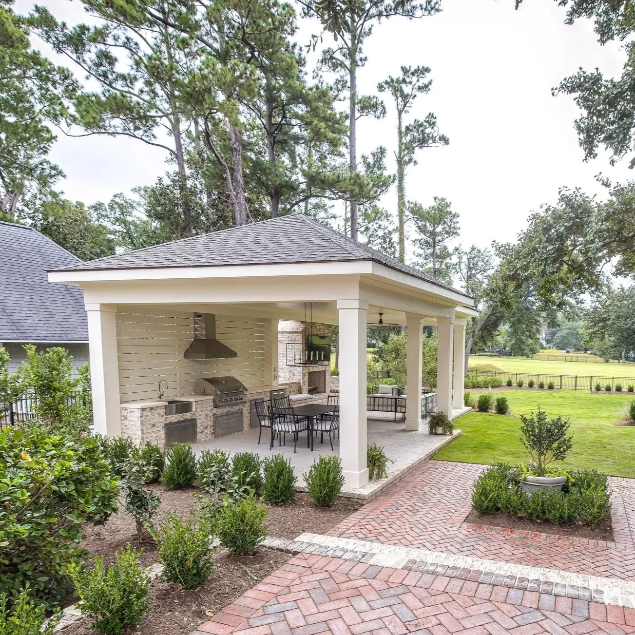 Outdoor living retreat with stone patio in Wilmington, NC