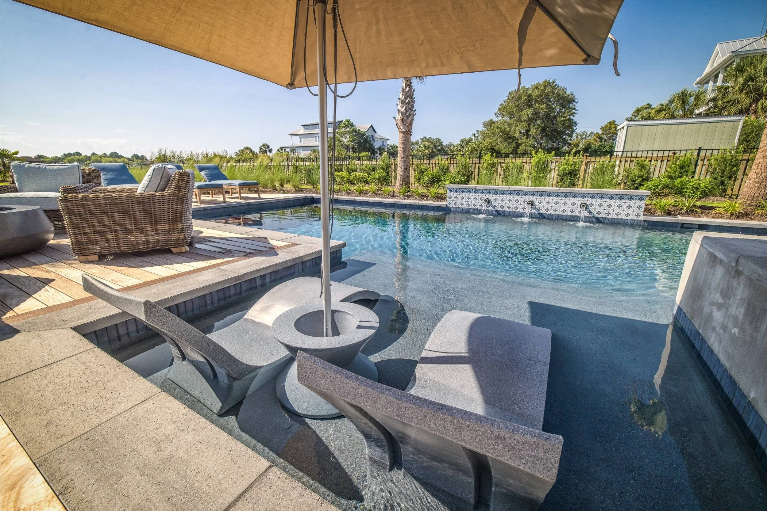 A custom patio with outdoor furniture and water views in Carolina Beach, NC