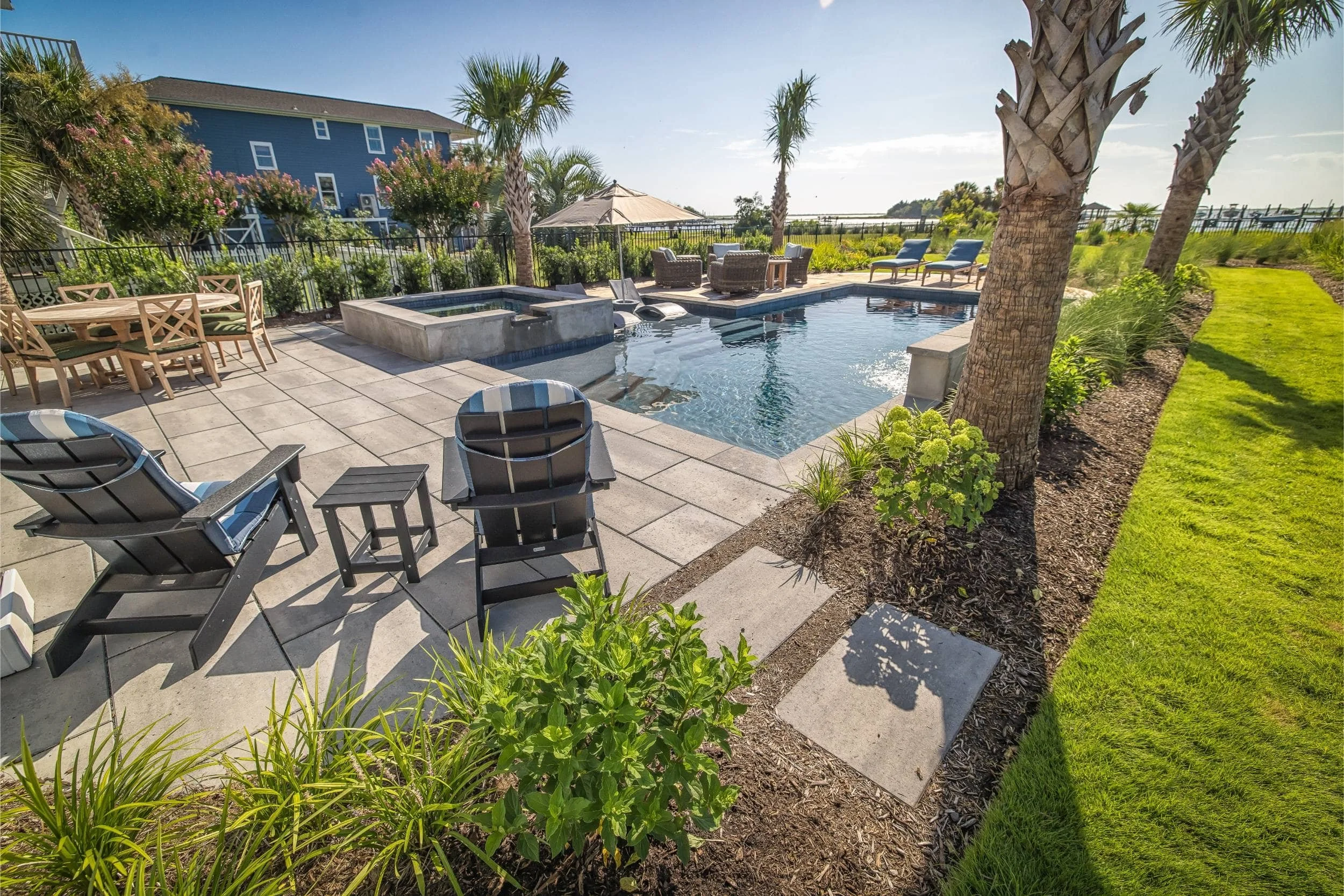 A backyard outdoor kitchen and patio space for gatherings in Wrightsville Beach, NC