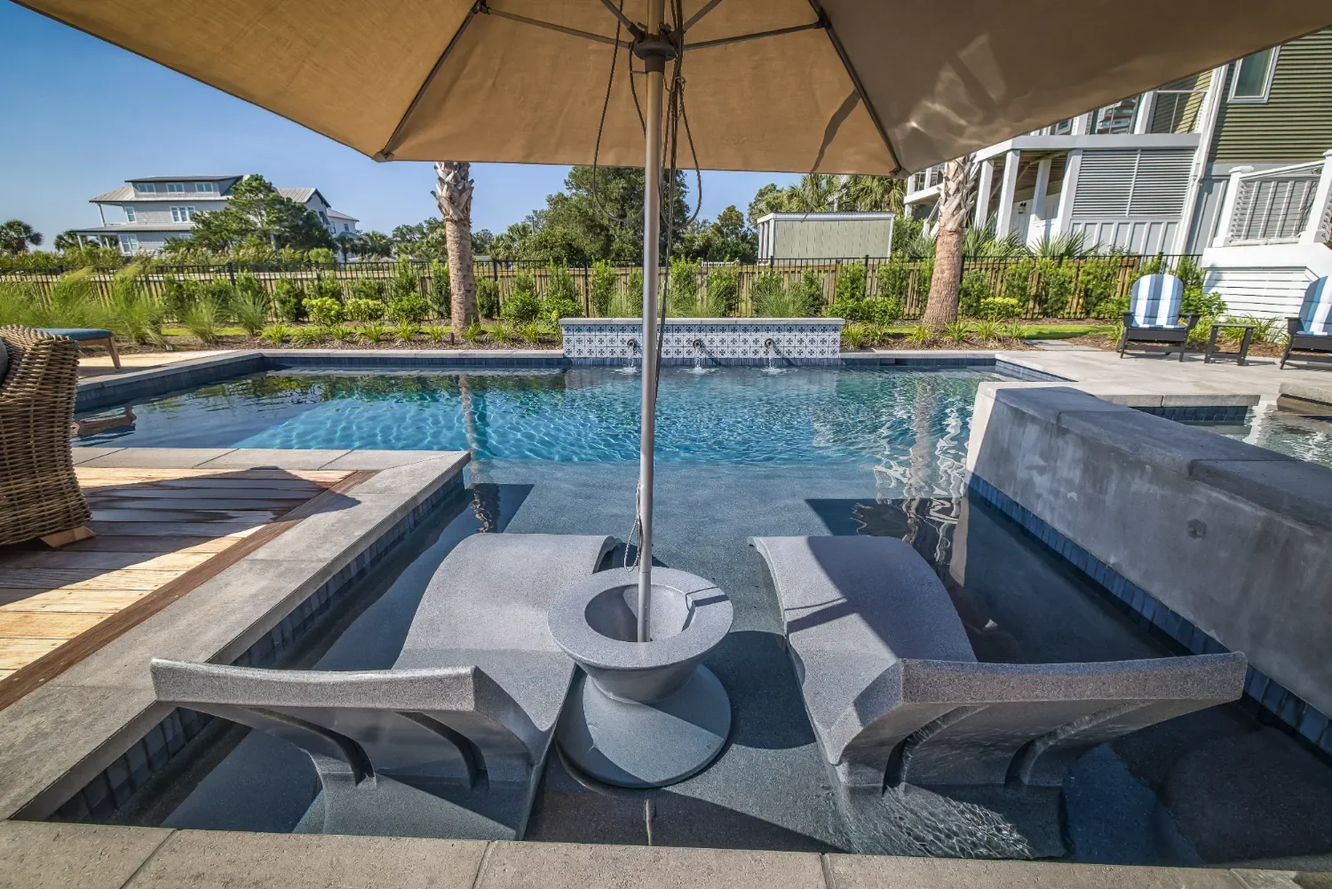 Outdoor living patio with outdoor fireplace accents in Figure Eight Island, NC