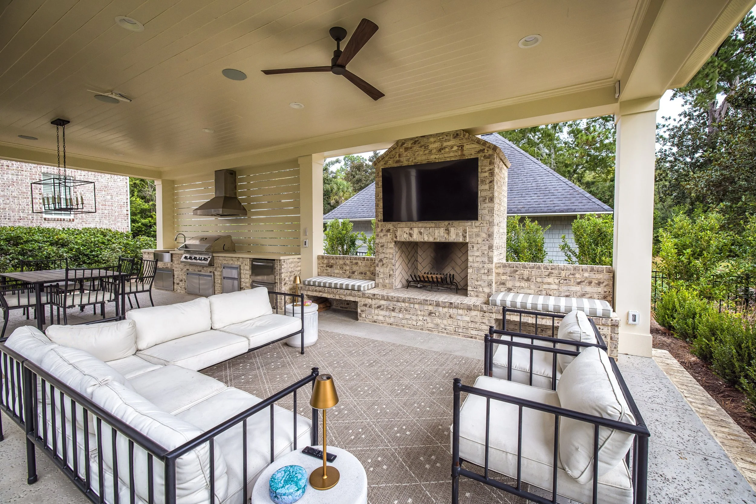 Outdoor fireplace in Landfall, NC with a stone surround serving as a focal point for a patio seating area