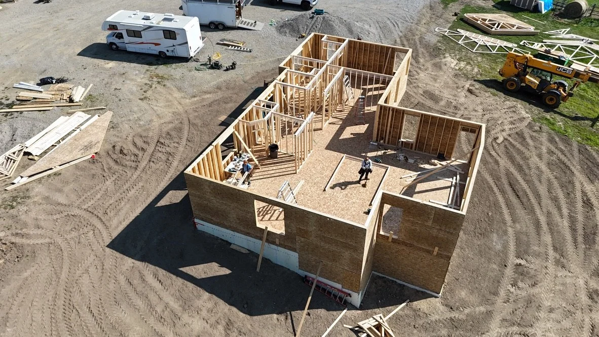 Aerial image of a home being framed.