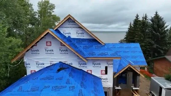 Lakeside home featuring Tyvek house wrap and roofing underlayment.