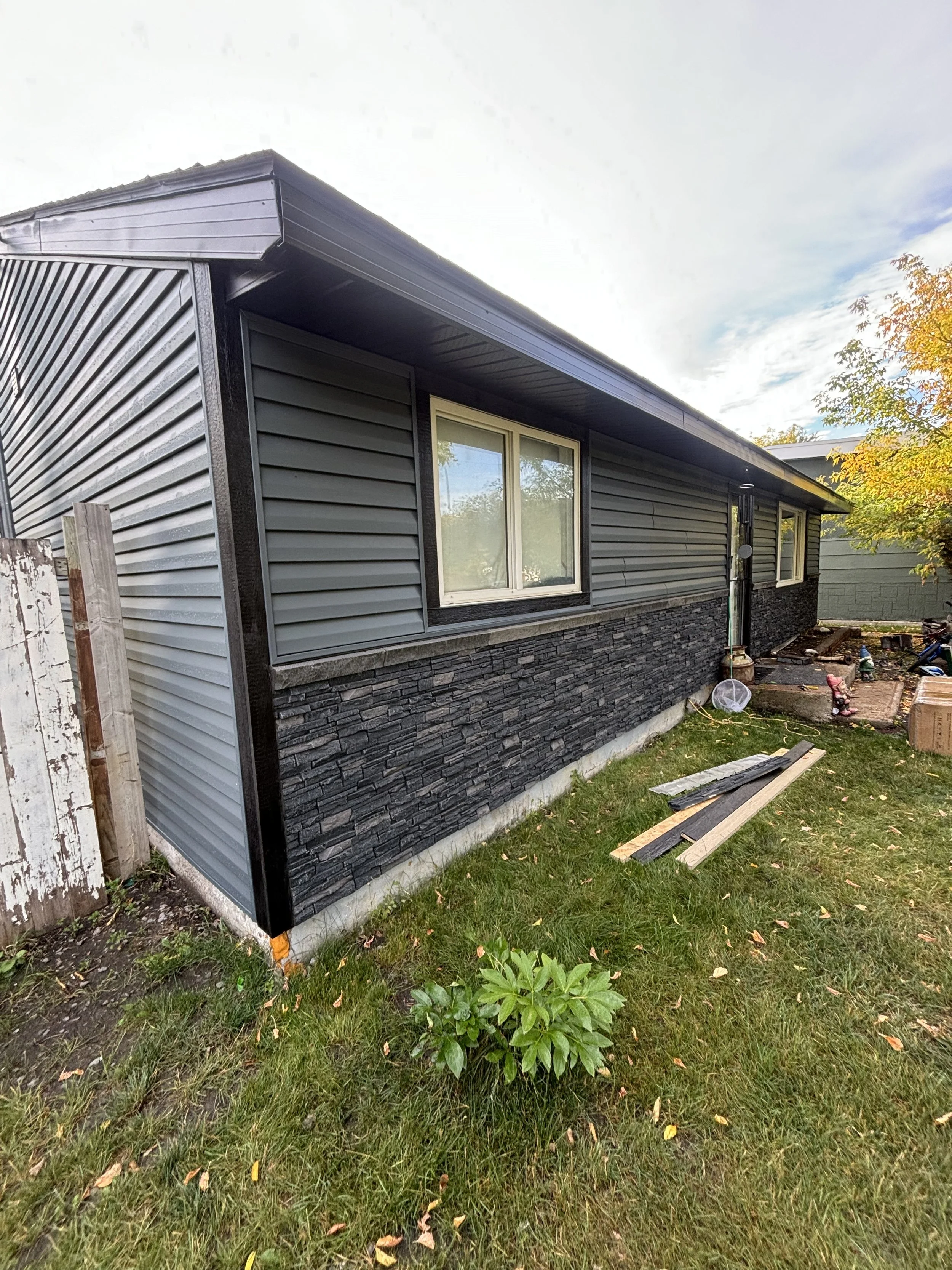 Exterior Finishing image of the KaiViTi team working on the exterior finishing of a home.