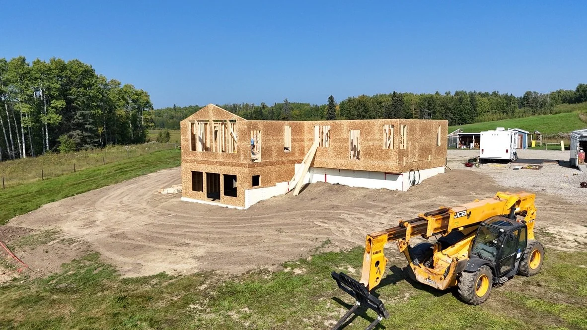 Newly built home being framed with equipment out