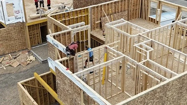 Aerial image of the KaiViTi Construction team framing a custom home near Red Deer, Alberta.