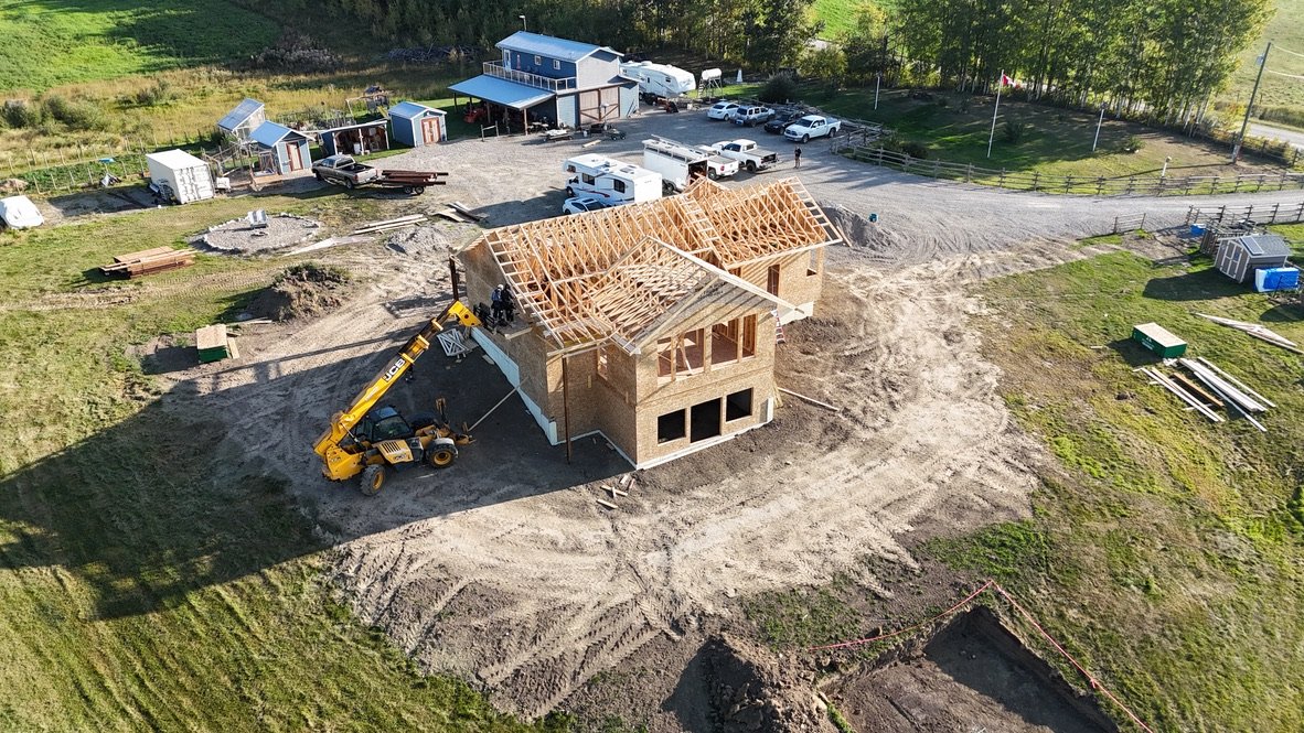 Aerial image of a newly built home being framed.