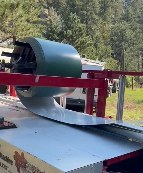 Rolls out custome seamless gutters.