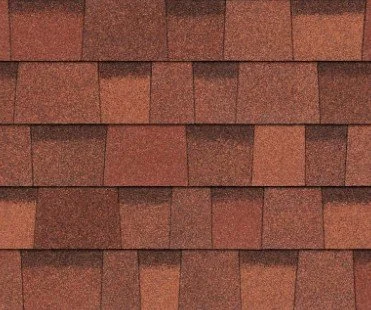 Close-up of a roof with brown asphalt shingles arranged in overlapping rows.