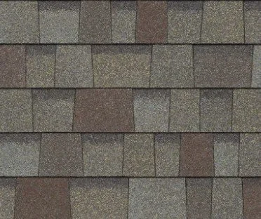 Close-up of a roof with asphalt shingles in gray and brown tones.