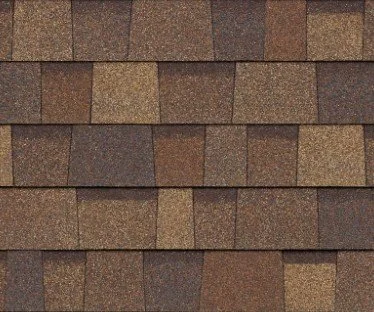 Close-up view of a roof with brown asphalt shingles arranged in overlapping rows.