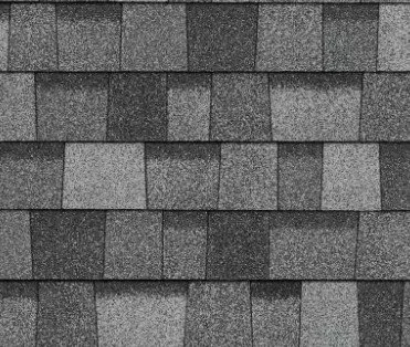 Close-up of a roof with gray asphalt shingles arranged in horizontal rows.