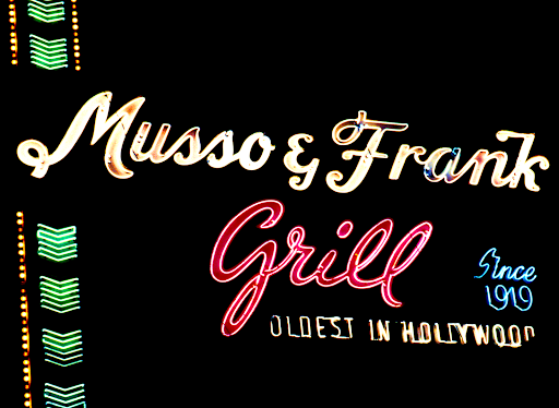 Neon sign for Musso & Frank Grill, established since 1919, claiming it is the oldest in Hollywood.