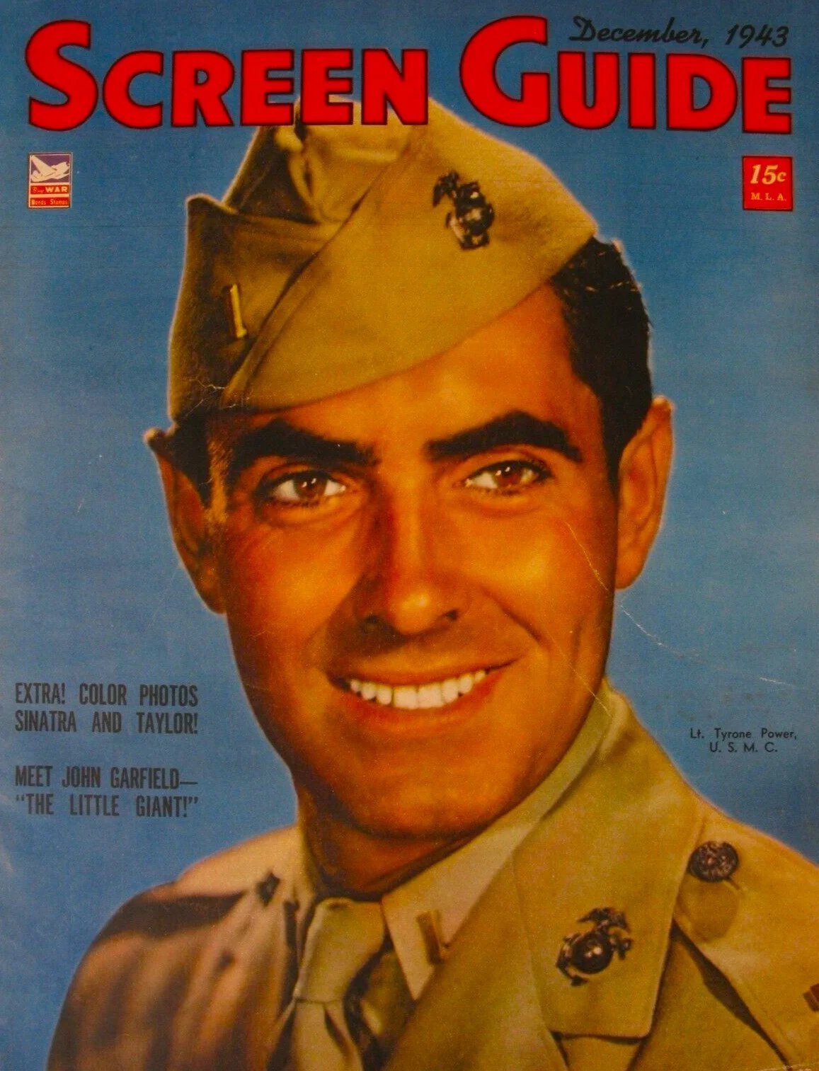Cover of December 1943 issue of 'Screen Guide' magazine featuring a smiling man in a military uniform and cap.
