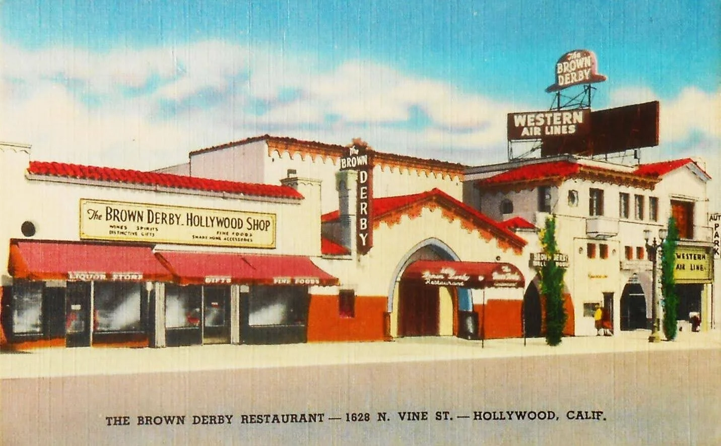 A vintage illustration of The Brown Derby Restaurant in Hollywood, California, featuring a building with white walls, red-tiled roofs, and signs advertising the restaurant, liquor store, and Hollywood shop.