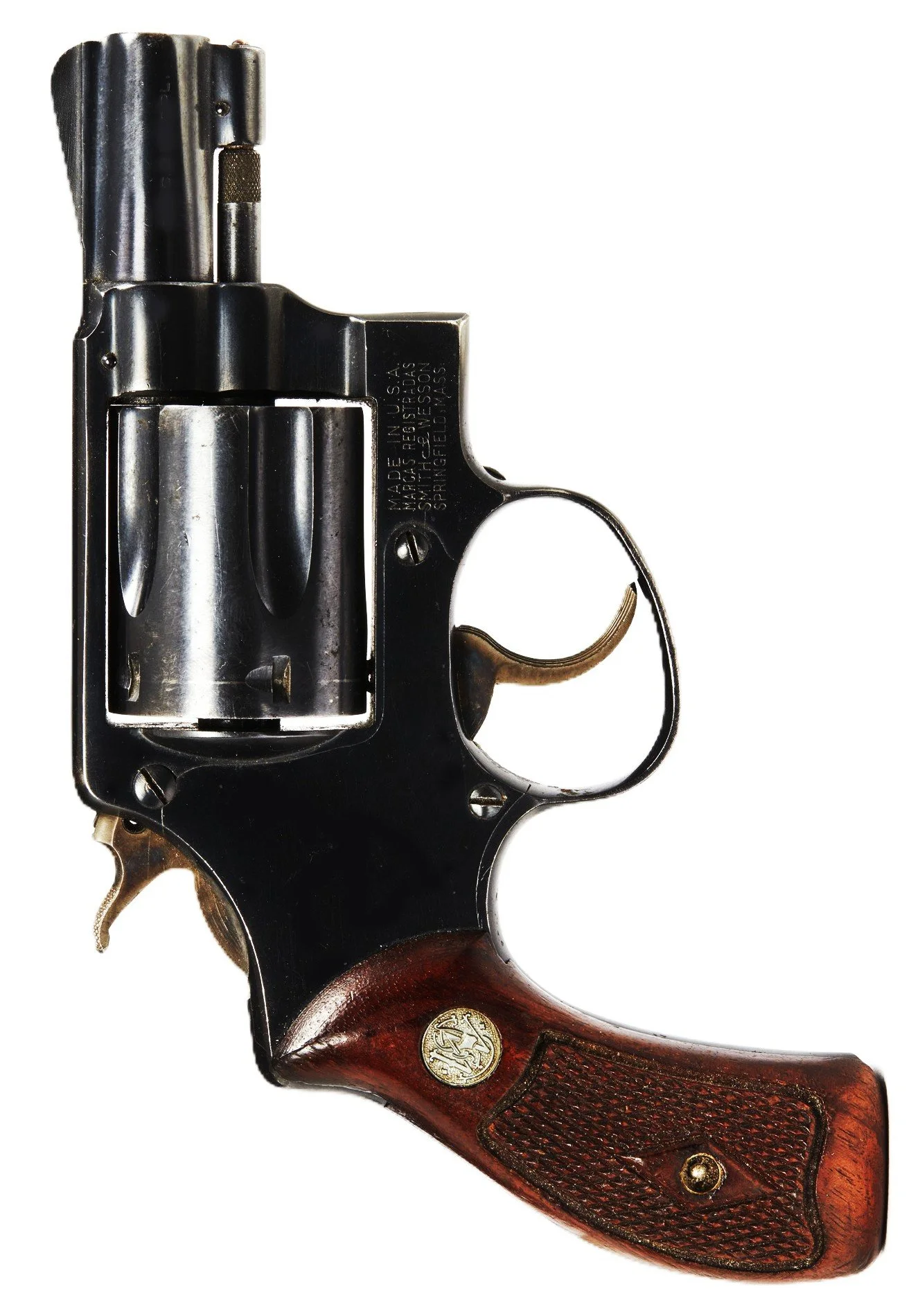 A close-up of a vintage revolver with a black metal body and a wooden grip.