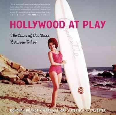 Book cover titled "Hollywood at Play" showing a woman in a pink swimsuit holding a surfboard on a beach with rocks and ocean waves.