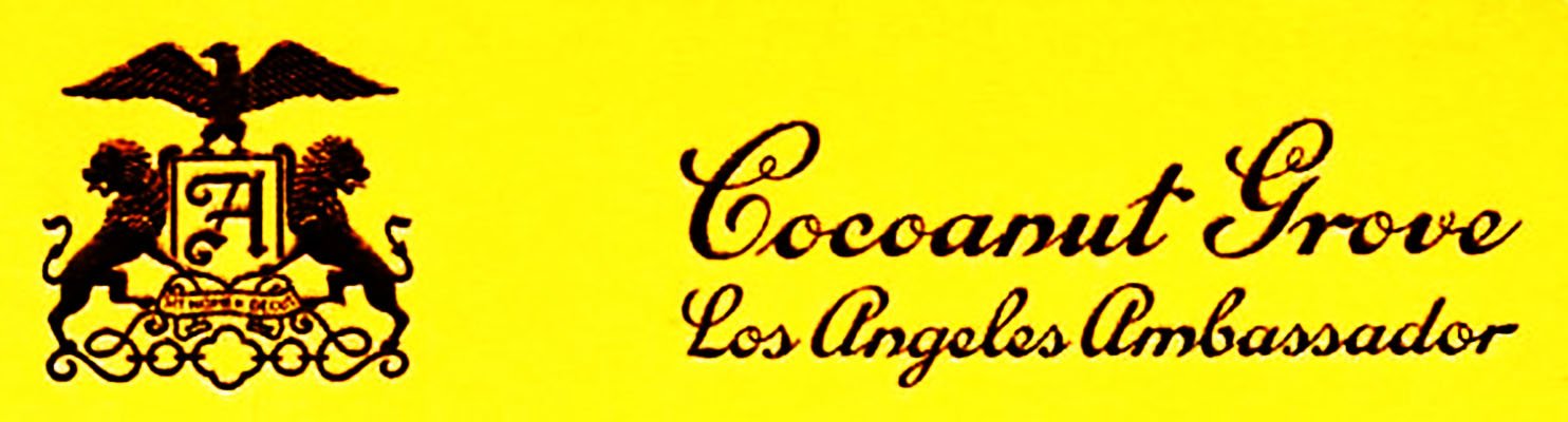 Yellow packaging label with a black crest featuring an eagle and two lions, and the text "Cocoanut Grove Los Angeles Ambassador."
