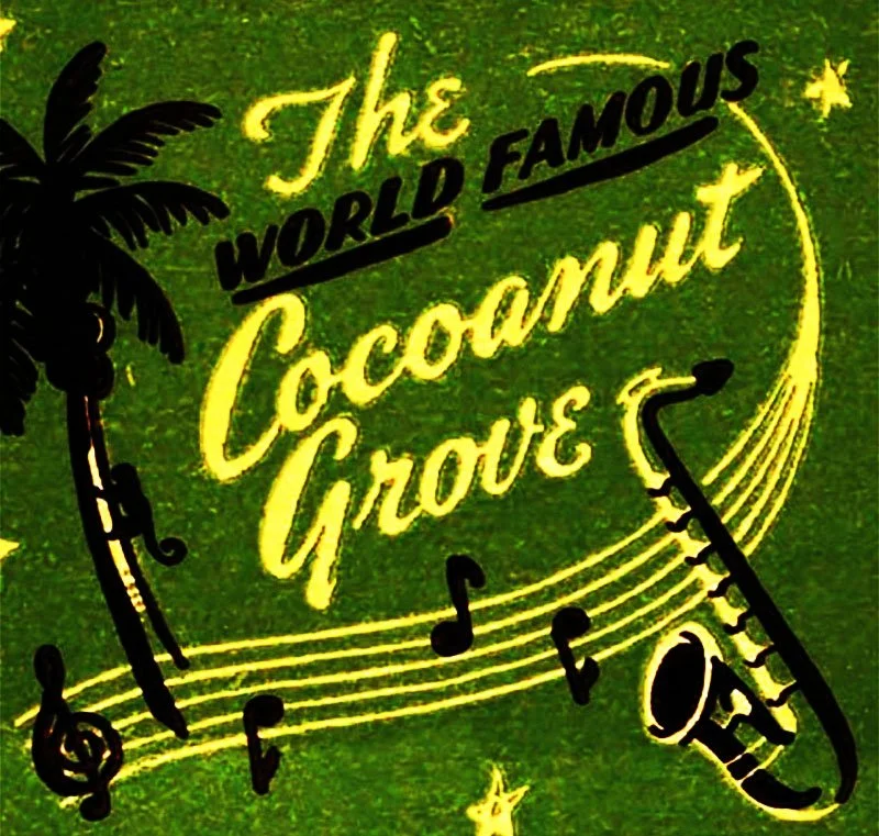 Sign reading "The World Famous Coconut Grove" with musical notes, a silhouette of a palm tree, and a saxophone on a green background.