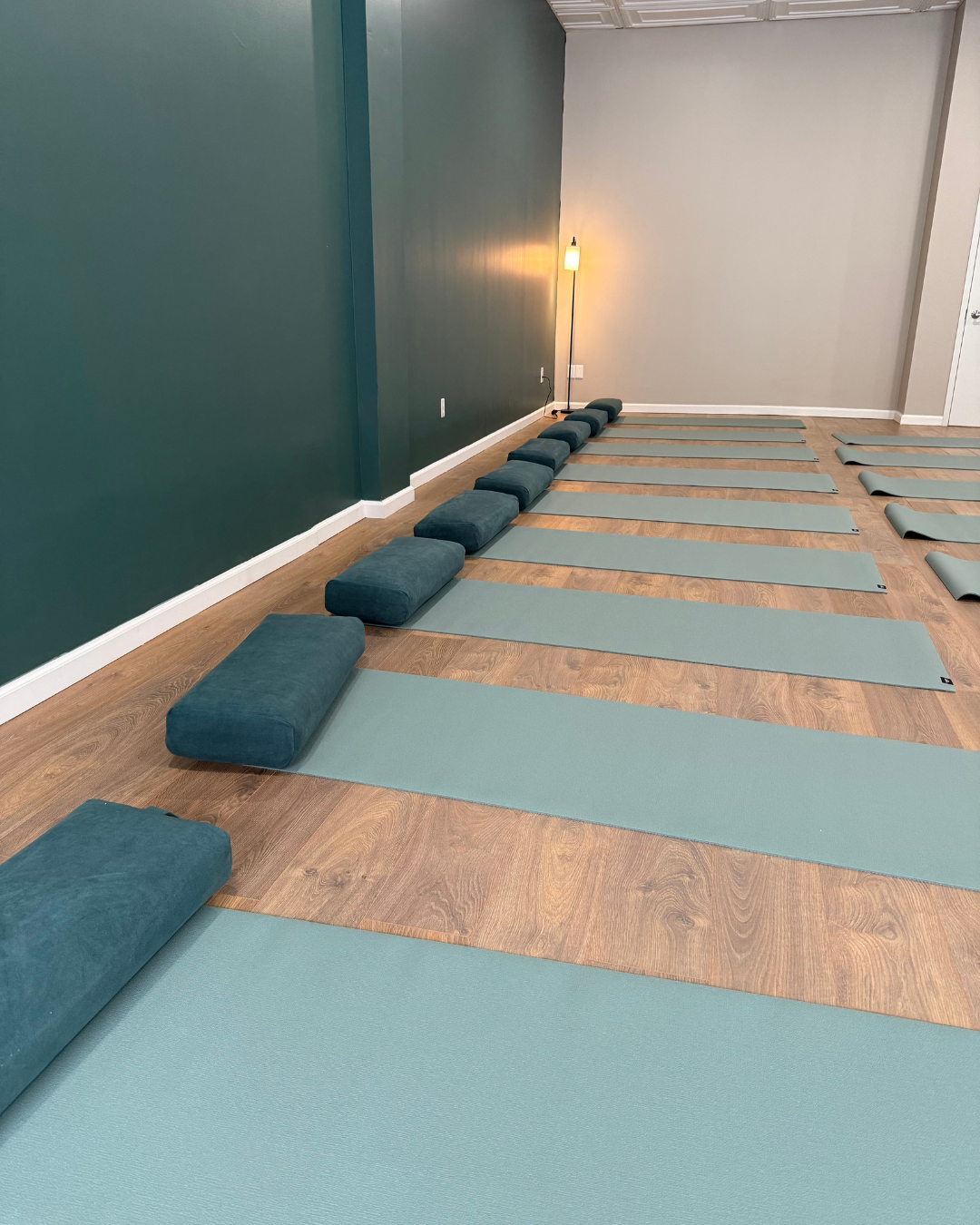 Lila Within teachers and students inside the boutique yoga and pilates studio