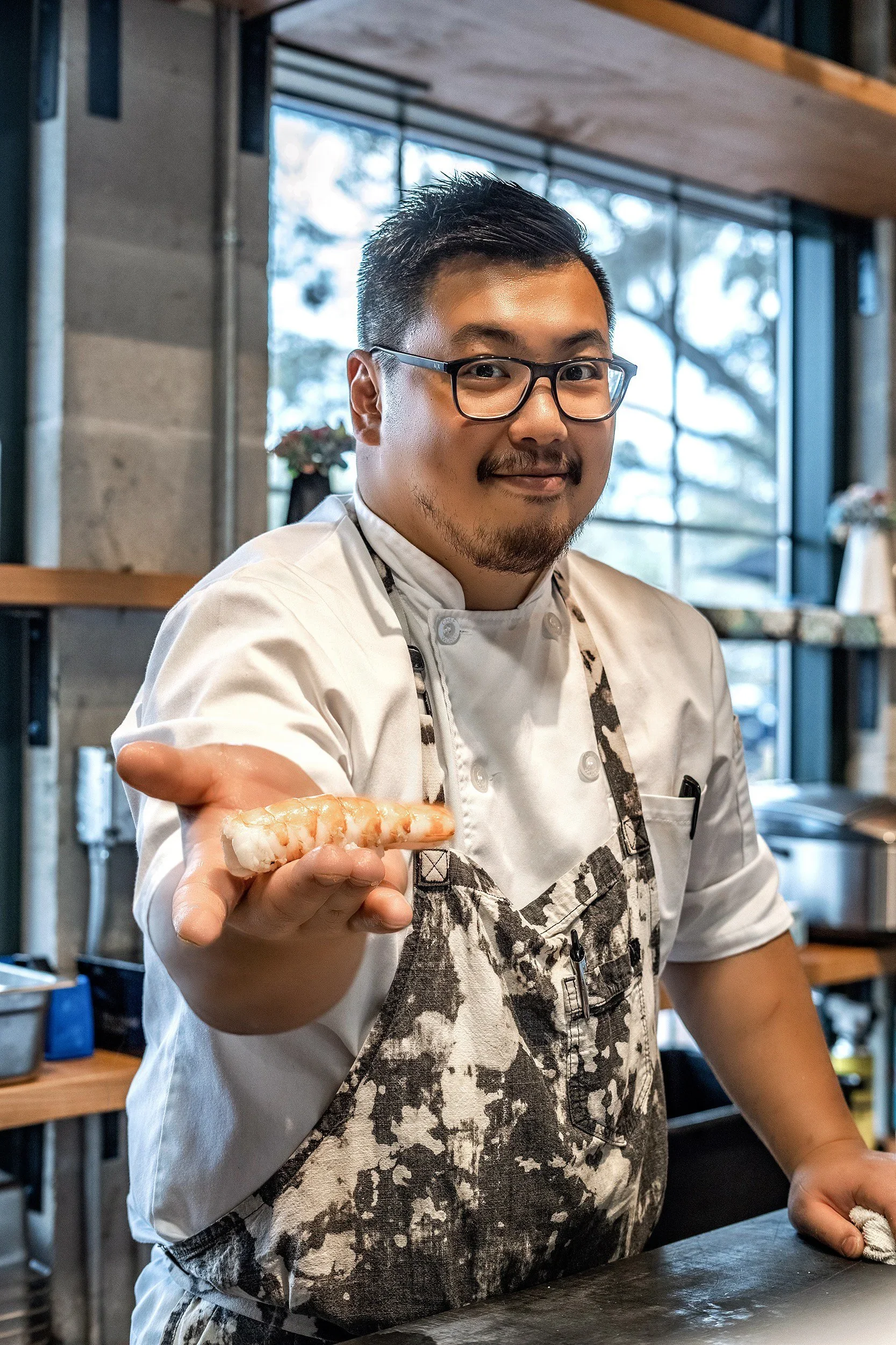 Chef David Tsan welcoming guests to Kappo Tsan, bringing his Michelin-recognized omakase and fine dining experience to O-Town West in Orlando, FL.
